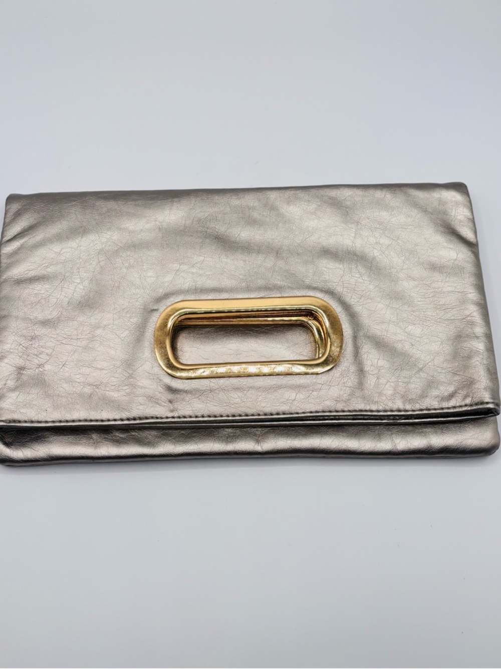 Jennifer Lopez Metallic Fold-Over Clutch with Cut Out Gold Handle